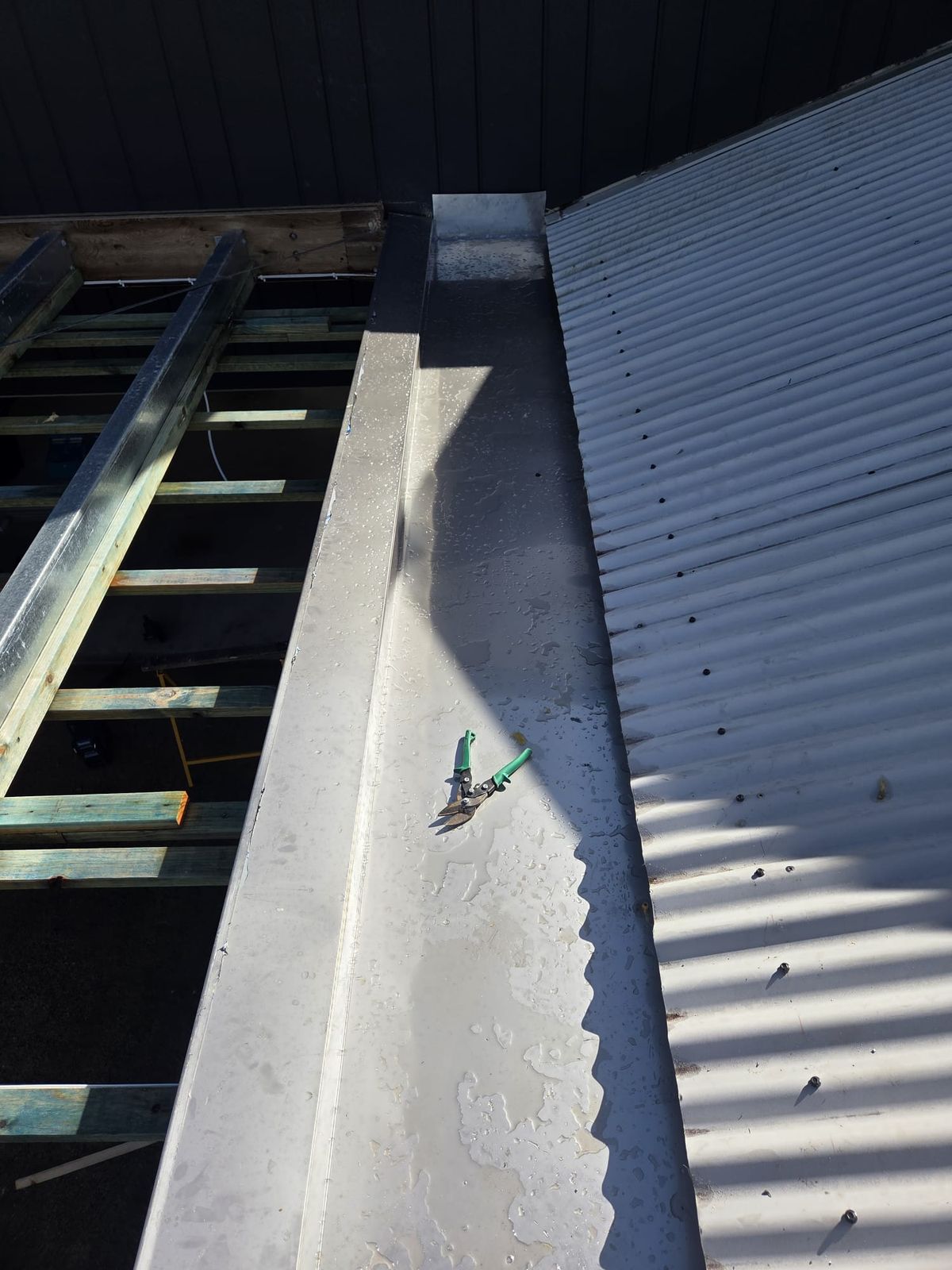 Galvanised box gutter and flashing on a carport roof