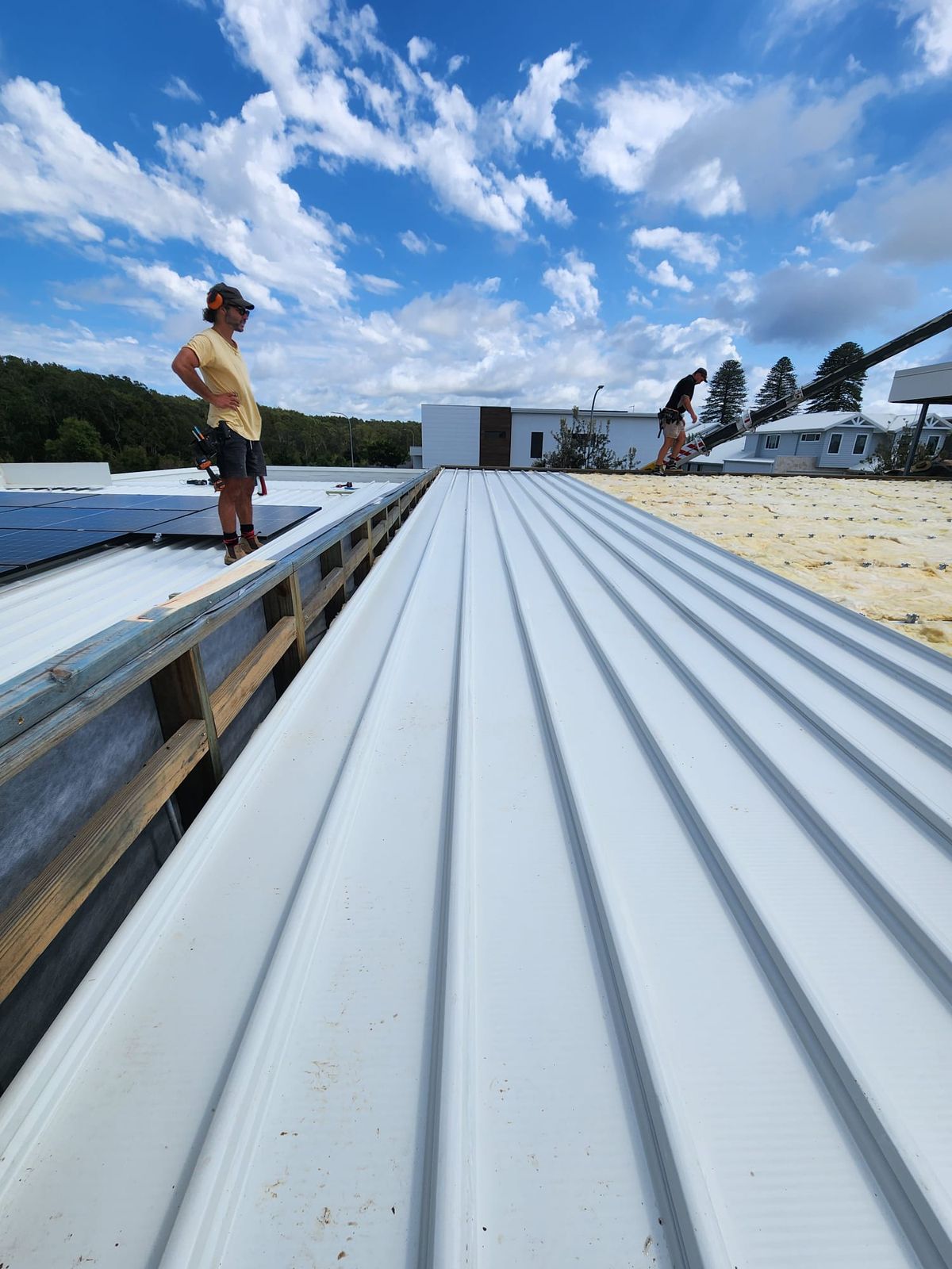 White metal roof sheets on a low pitch roof at Lennox Head